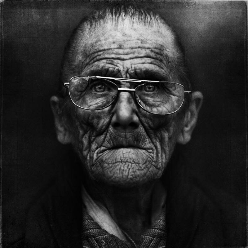 old man with glasses by lee jeffries