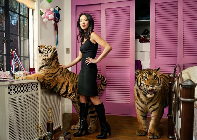 a girl and her cats by martin schoeller